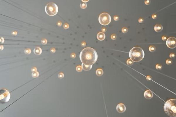 Hanging lightbulbs viewed from below