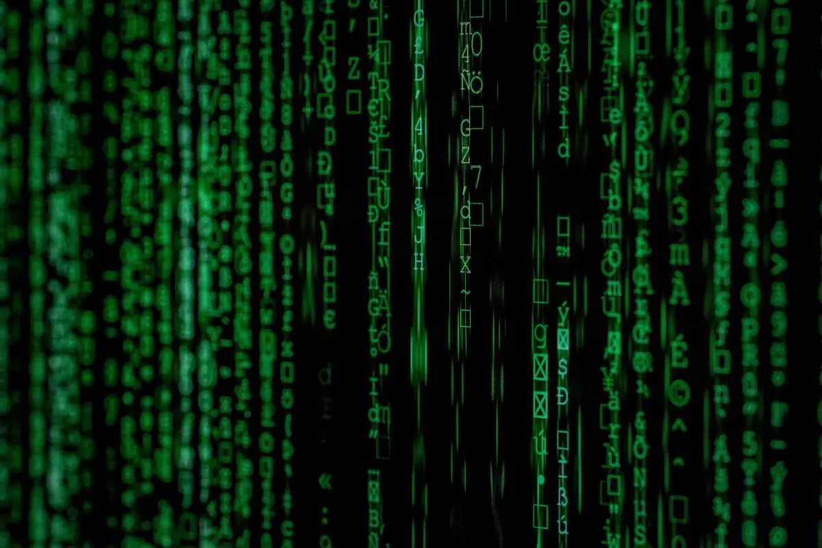 Strings of green code against a black background